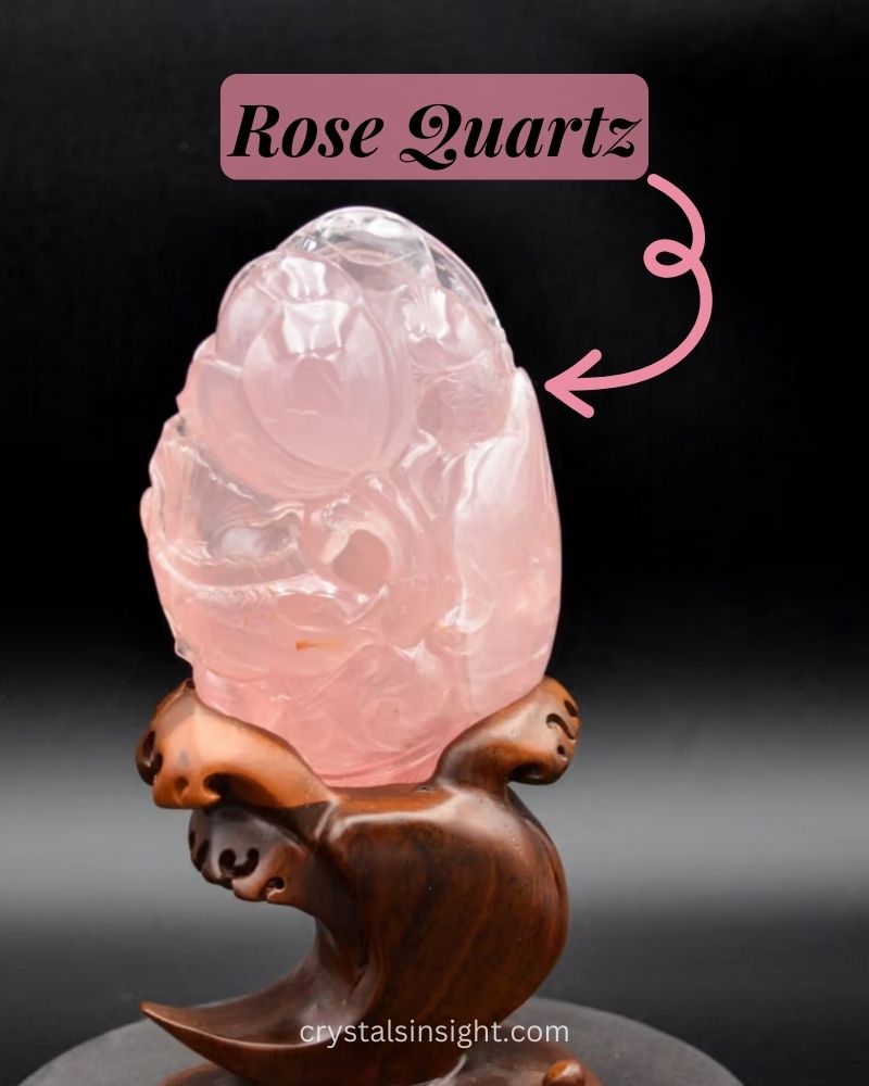 Rose quartz resembles a soft pink cloud, exuding gentle warmth and tranquility on wooden stand