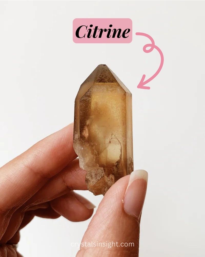 Citrine stone in a hand of a girl 