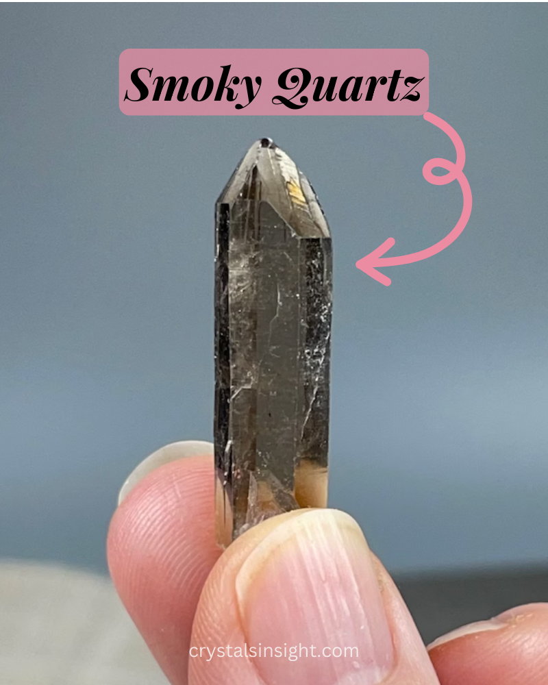 Smoky Quartz a dusky brown gemstone in holding in a hand 