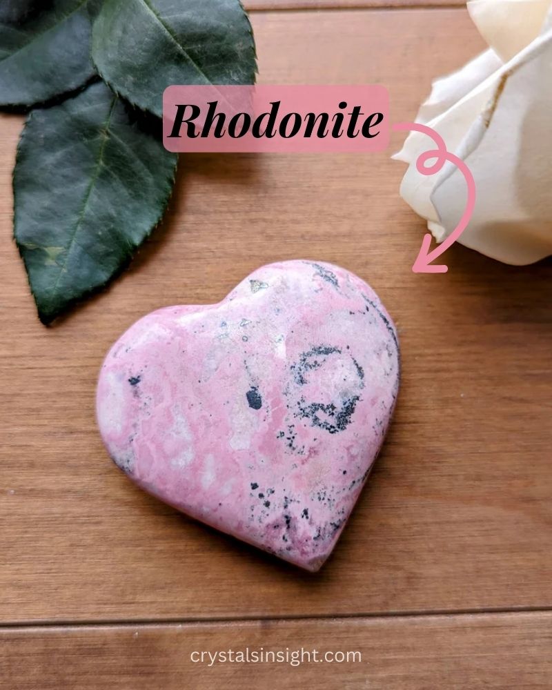 Heart shaped Rhodonite on table 