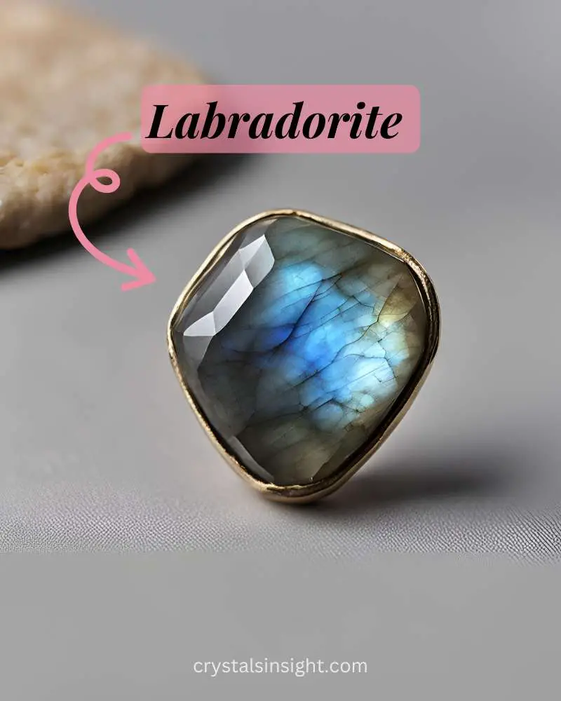  Labradorite is a grayish stone with flashes of iridescent colors like blue, green, and gold, known for its mystical aura.